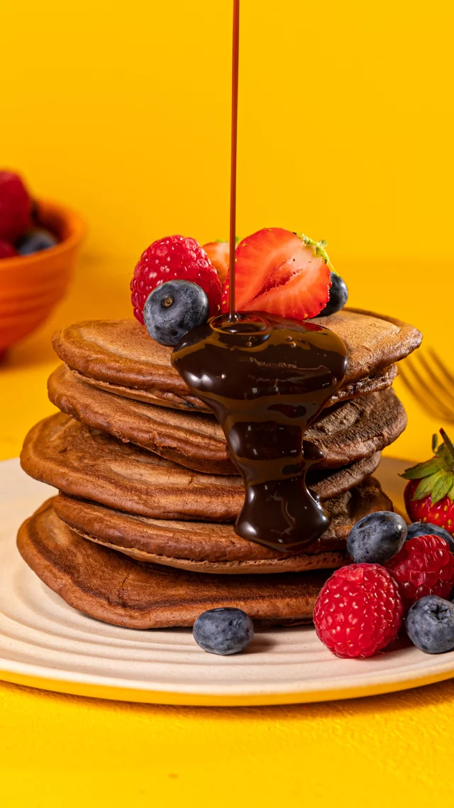 *Counting down the hours to Pancake Day*
It's right around the corner, so the ultimate stack preparations begin. Whether you’re planning your pancakes or practicing over the weekend (we are!), add these delicious chocolate pancakes to your list. We top ours with strawberries and raspberries but you could choose extra choc chips, melted Nutella, or even ice cream for an epic Pancake Day treat.
 
1. Place 250g self-raising flour, 2tbsp cocoa powder, 1tbsp caster sugar and a pinch of salt in a large bowl and mix.
2. Pour 200ml milk into a measuring jug, along with a squeeze of lemon juice, and crack in 2 eggs.
3. Whisk well and then whisk the wet mixture in to the dry, until just combined.
4. Fold in a handful of chocolate chips.
5. Place a large frying pan on a medium heat, pour in a little melted butter and use a piece of kitchen roll to spread it around the pan.
6. ou will need to make the pancakes in batches. Use a ladle to pour circles of batter into the pan.
7. Cook on one side until bubbles form on the surface, then flip and cook on the other side.
8. Turn out on to a plate, keep in a warm oven if needed and repeat the process until all the batter is used.
9. Serve the pancakes in stacks, with a little butter and a few chocolate chips, plus your favourite toppings.

#Pancakes #PancakeDay #ChocolatePancakes #Eggs
