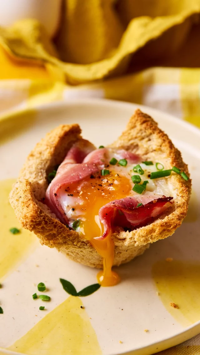 If your summer holidays are packed with family trips to play parks or days out at the beach, then you’ll be packing picnics galore in order to cut costs.

Save this recipe ☝️ to try making these egg and streaky bacon cups for your next outdoor adventure with the kids. Feel free to fill your cups with anything you can find in the fridge, and watch their faces light up when you pull out your basket at lunchtime.

Raid the kitchen for:

6 slices wholemeal bread
4 spring onions, finely sliced
40g mature cheddar cheese, grated
6 streaky bacon rashers
6 large FREE eggs
Sea salt & cracked black pepper
TO SERVE
10g chives, finely diced
‌
Preheat the oven to 200C/180C fan/gas 6.

Cut off and discard the bread crusts before gently rolling each slice with a rolling pin. Line the greased holes of the muffin tin with the bread slices to create cases to enclose the ingredients.

Add a pinch of spring onions to each case followed by the grated cheese. Lay a strip of streaky bacon round the edge of each cup before carefully cracking an egg in each hole.

Season each egg with a little salt and pepper before baking in the oven for 15 - 18 minutes just until the whites of the eggs are set but the yolk is runny.

Remove from the oven and carefully transfer the cup onto a cooling rack to fully cool ready for your picnic. Alternatively, serve warm straight from oven alongside a fresh green salad.