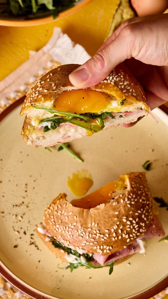 Need a speedy brunch idea?

Baking your FREE egg in the hole of the bagel is just the start of this egg-cellent recipe. Stuff your bagel with whatever tasty ingredients you fancy, we’ve gone for classic smoked salmon and rocket, plus ham and mayo, but this easy brunch can be mixed up with everyone’s favourite fillings.

Simple, filling and ready in no time, it’s perfect for lazy weekend mornings, picnic lunches or a sunny brunch around the table.

Ingredients:
 50g cheese, we used Smoked Applewood 4 bagels 4 FREE free range eggs Mayonnaise Ham Smoked salmon Rocket leaves

Method:

Preheat the oven to 200C/180C fan/gas 5.
Finely grate the cheese and place four equal piles of cheese on the lined baking tray, in circles the diameter of your bagels.

Slice the bagels in half before cutting a slightly larger hole in the top halves to encase the eggs. Place the top halves of the bagels on the cheese pile and press to ensure the bagels have stuck to the cheese.

Carefully crack a FREE egg in the well of the bagel tops and place in the oven, along with the bagel bottoms, to bake for 6 - 7 minutes, just until the egg has set but the yolk is still runny.
 Remove the bagels from the oven and allow to sit for 1 minute whilst you prepare the fillings. We love mayo, ham and leaves as well as mayo, smoked salmon and rocket.

Layer the fillings onto the bottom halves of the bagels. Using a fish slice, carefully remove the top bagels from the baking paper and gently place on top.
 Slice and enjoy!