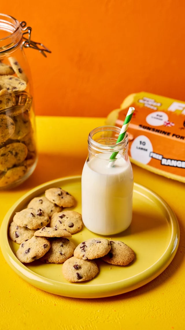 Tiny cookies, big smiles 🍪

Made with FREE eggs and packed with chocolate chips, these mini cookies are perfect for little hands, family baking fun and those snack moments everyone looks forward to.

Pop them in lunchboxes, bring them out for parties, take on picnics or enjoy with a cold glass of milk, just don’t expect them to last long!

Simple, sweet and eggs-tra fun to make together.

Prep time: 20 minutes Cook time: 8 minutes

Makes: approximately 100 mini cookies

Ingredients:

- 150g salted butter, softened
- 75g caster sugar
- 75g soft brown sugar
- 1 tsp vanilla paste
- 1 large FREE egg
- 200g Plain flour
- 1/2 tsp bicarbonate of soda
- 150g chocolate chips, dark or milk

You will need:

- Piping bag
- Large baking sheet/s, lined with baking paper

Method:

1. Cream together the butter, sugars and vanilla until light and fluffy. Crack in the egg and briefly mix again.

2. Sieve in the flour and bicarbonate of soda before sprinkling in the chocolate chips. Mix together just until a sticky dough comes together.

3. Spoon the sticky dough into a piping bag, approximately 1cm in diameter. Pipe the cooking dough into small 1.5cm (approx.) rounds on the baking sheet, ensuring space between each one - you may have to cook the cookies in batches. Place in the fridge for at least 15 minutes before baking too completely firm up.

4. Preheat the oven to 170C/160C fan/gas 5. When the cookies are firm, place in the oven and bake for 8 minutes, or until they are just turning golden at the edges. Remove from the oven and allow to cool on the tray. Repeat with the remaining dough.

5. Once fully cooled, use a spatula to carefully remove the cookies from the baking paper. Eat straight away alongside a glass of cold milk or store in an airtight container for 5 days (if they last that long!).