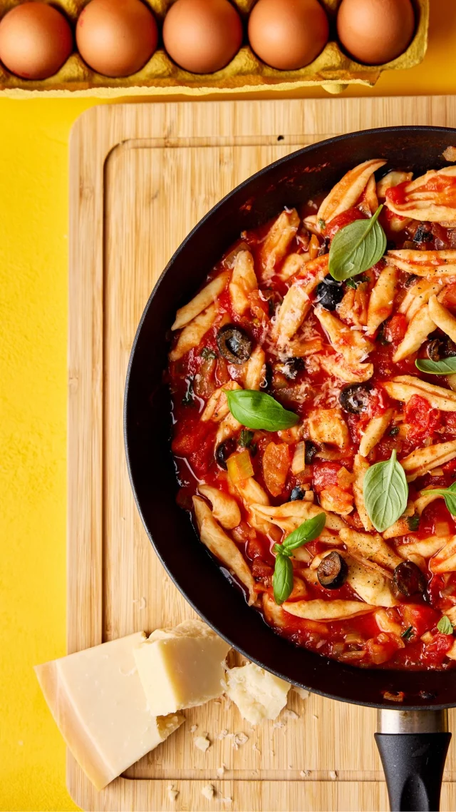 Looking for a fun school holiday activity that ends with a delicious lunch or tea?

Roll up your sleeves, gather the little ones and make fresh pasta from scratch! Our simple scissor pasta is the perfect recipe for getting everyone involved, with plenty of mixing, snipping and giggles along the way.

Made with FREE eggs, it’s a brilliant way to turn a family afternoon into a tasty meal you’ll all be proud of. Simple, yummy and guaranteed to bring everyone to the table.

Ingredients:

• For the pasta
• 200g 00 pasta flour, plus extra for dusting
• A pinch of sea salt
• 3 large FREE eggs
• For the tomato and olive sauce
• 1 tbsp olive oil
• 1 onion, finely diced
• 1 garlic clove, crushed
• 50g pitted black olives, roughly chopped
• 1 tbsp dried oregano
• 400g tin chopped tomatoes
• ½ tsp runny honey (optional)
• Sea salt and cracked black pepper
• A handful of fresh basil, roughly chopped

To serve:
• Freshly grated Parmesan
• A few fresh basil leaves
‌
Method:

1. Make a well in the flour and salt, then crack in the FREE eggs. Mix with a fork until a dough forms.

2. Knead for 8–10 minutes until smooth. Cover and rest for 30 minutes.

3. Soften the onion in olive oil for 4–5 minutes. Add the garlic, olives and oregano, then cook for another minute.

4. Stir in the tomatoes, season and add honey if needed. Simmer for 8–10 minutes until thickened.

5. Snip bite-sized pieces of dough directly into boiling salted water. Cook for 8–10 minutes, until tender.

6. Drain and toss with the sauce and basil. Serve with plenty of Parmesan and extra basil.